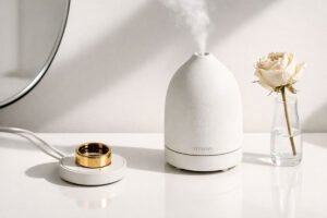 Valentine's Gifts for Women: A minimalist desk setup featuring an Oura Ring 4 and a cream leather mat in a neutral aesthetic